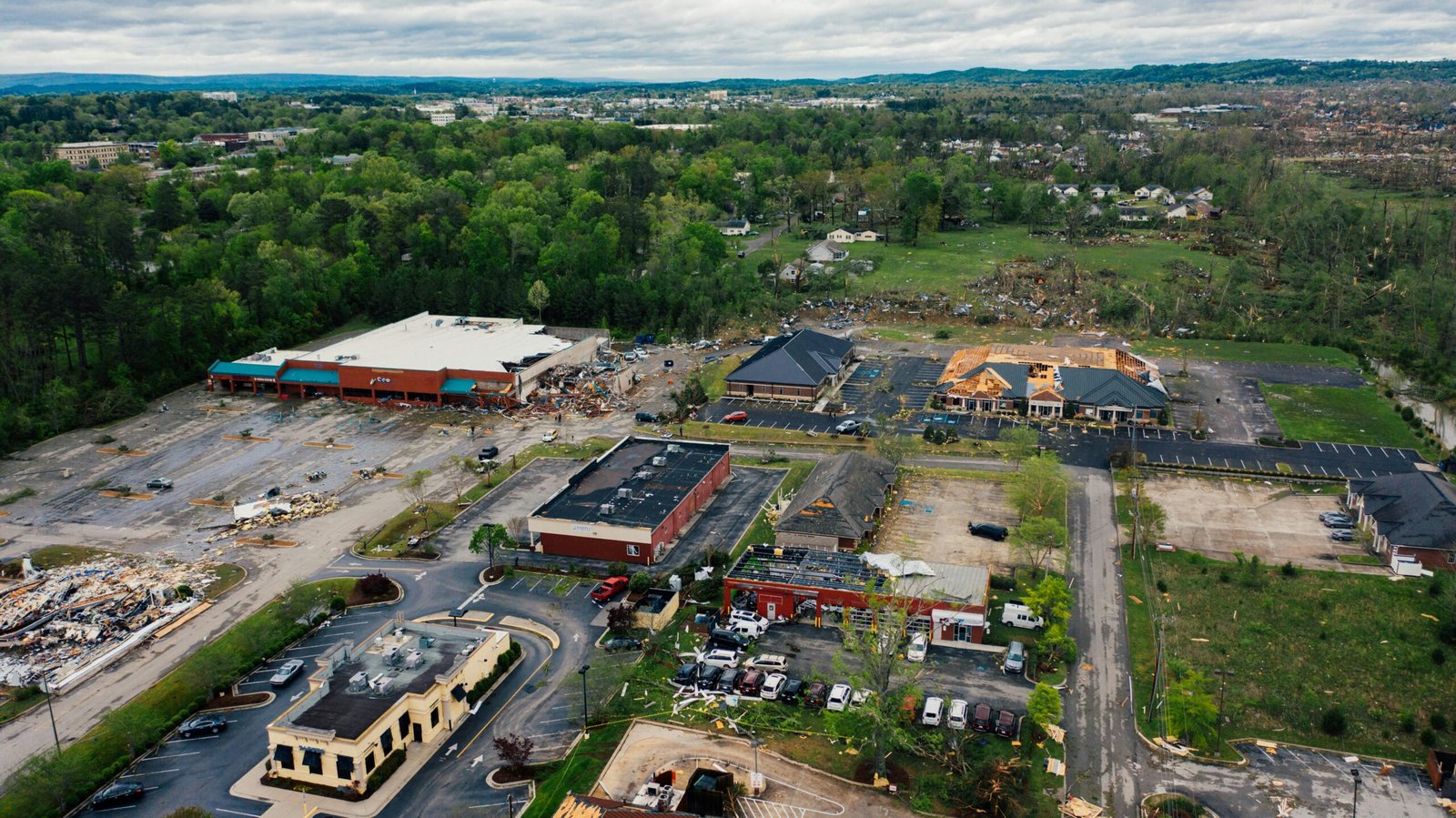 Aerial view showcasing tornado aftermath in Chattanooga, highlighting extensive building damage.